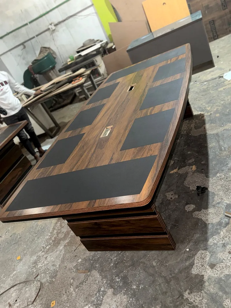Conference table in walnut finish with leather inlay panels